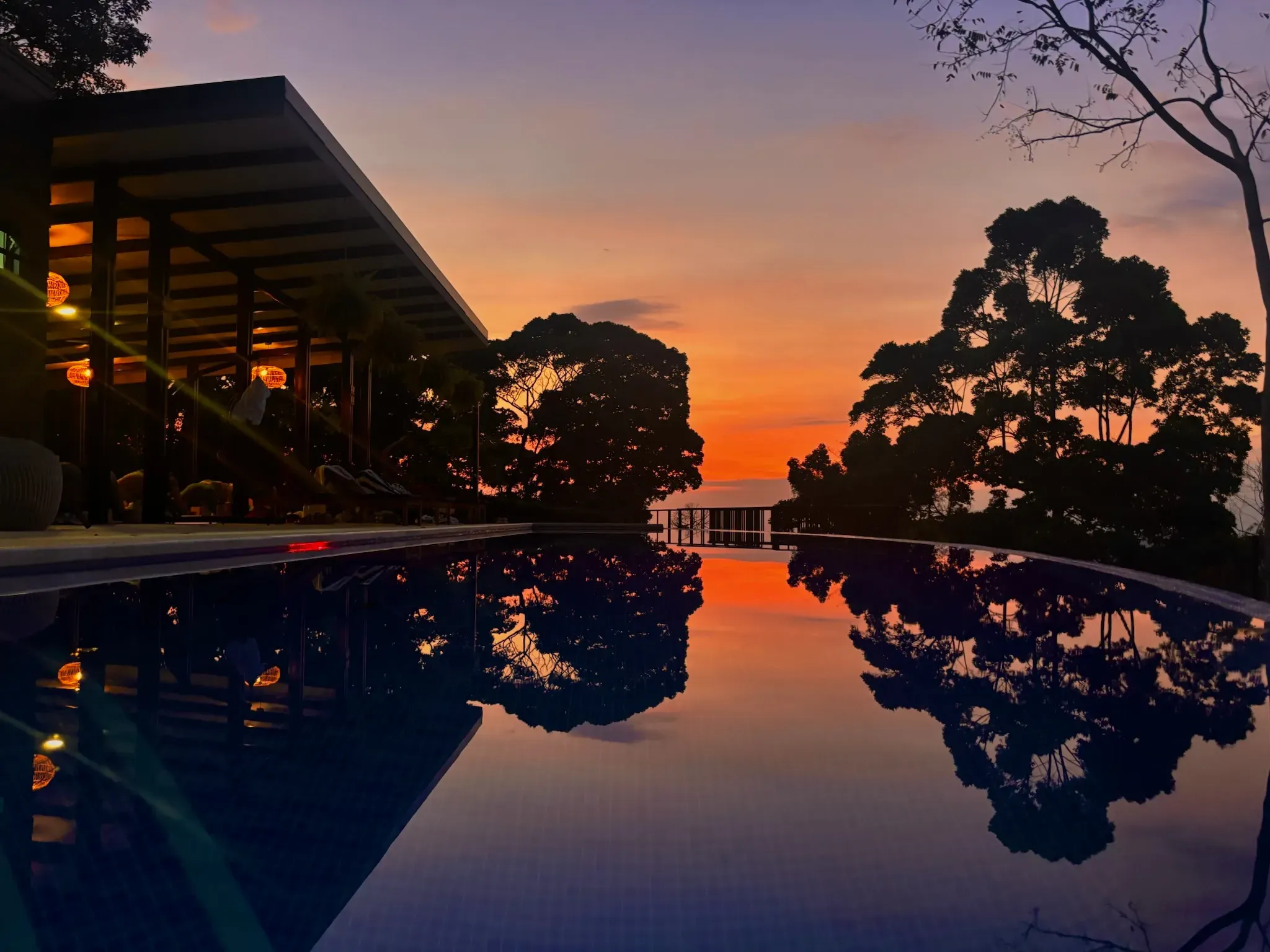 Infinity pool overlooking the ocean at golden hour